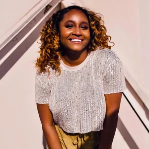 Smiling Womanin Silver Sequin Top Wallpaper