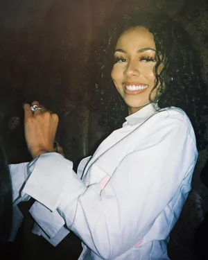 Smiling Womanin White Blouse Wallpaper