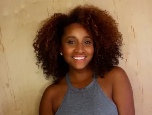 Smiling Womanwith Curly Hair Wallpaper