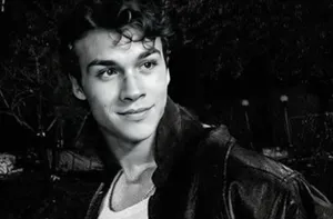 Smiling Young Man Leather Jacket Wallpaper