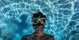 Snorkeling Back-float Portrait Wallpaper