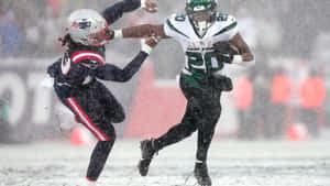 Snowy Football Game Action Wallpaper