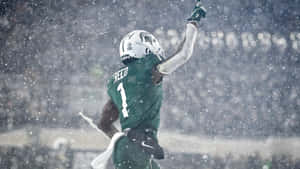 Snowy Football Game Celebration Wallpaper