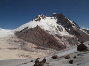 Snowy_ Mountain_ Peak_with_ Glacial_ Features Wallpaper