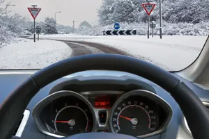 Snowy Road Drive During Winter Season Wallpaper