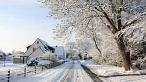 Snowy Village In Winter Wonderland Wallpaper