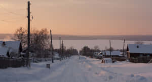 Snowy Village Scenery Wallpaper