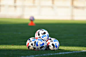 Soccer Ballson Field During Training Wallpaper