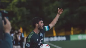 Soccer Captain Giving Directions On Field Wallpaper