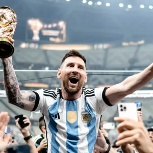 Soccer Champion Celebrationwith Trophy Wallpaper