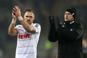 Soccer Player Applauding Fans Rainy Game Wallpaper