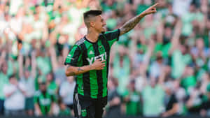 Soccer Player Celebratingon Field Wallpaper