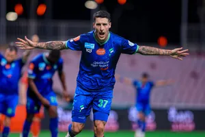 Soccer Player Celebrationon Field Wallpaper