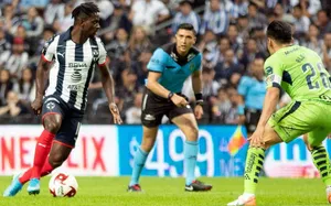 Soccer Player Controling Ball During Match Wallpaper