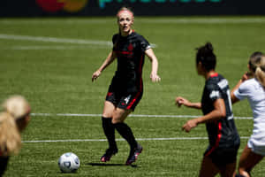 Soccer Player Controlling Ball During Match Wallpaper