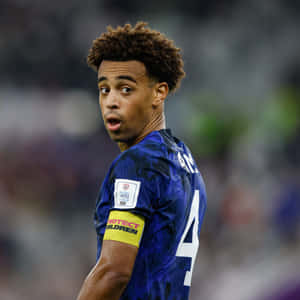 Soccer Player Glance Field Action Wallpaper