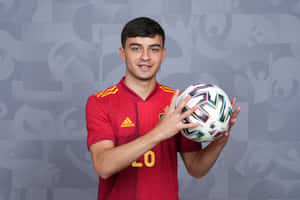 Soccer Player Holding Ball Spain Jersey Wallpaper