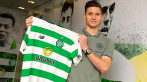 Soccer Player Holding Team Jersey Wallpaper