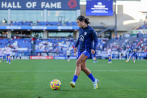 Soccer_ Player_in_ Action_at_ Stadium Wallpaper