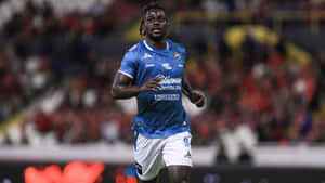 Soccer_ Player_in_ Action_ During_ Match Wallpaper