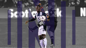 Soccer_ Player_in_ Action_ During_ Match Wallpaper