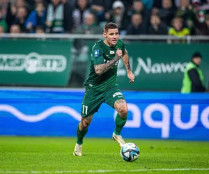 Soccer Player In Action Green Kit Wallpaper