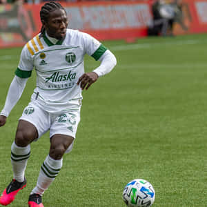 Soccer_ Player_in_ Action_on_ Field Wallpaper