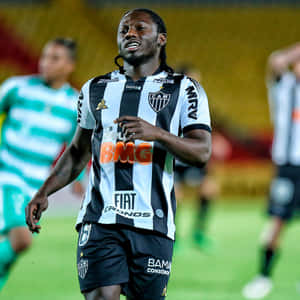 Soccer_ Player_in_ Action_on_ Field Wallpaper