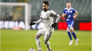 Soccer_ Player_ In_ Action_ On_ Field.jpg Wallpaper