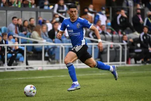 Soccer_ Player_in_ Action_on_ Field.jpg Wallpaper