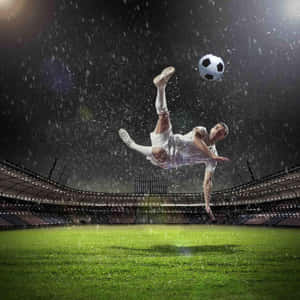 Soccer Player Kicking A Soccer Ball In The Rain Wallpaper