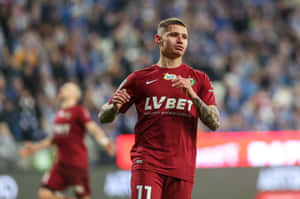 Soccer Player Patryk Klimala In Action Wallpaper