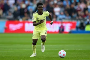 Soccer Playerin Actionon Field.jpg Wallpaper