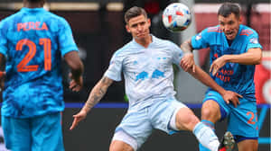 Soccer Players Intense Match Moment Wallpaper