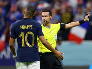 Soccer Referee Decision Moment Wallpaper