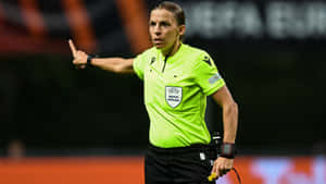 Soccer Referee Signaling During Match.jpg Wallpaper