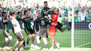 Soccer Team Celebration Moment.jpg Wallpaper