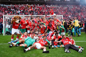 Soccer Team Celebrationwith Trophy Wallpaper