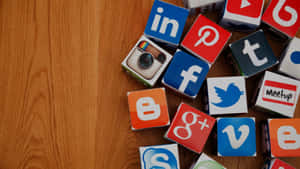 Social Media Apps Cubes On Wooden Surface Wallpaper