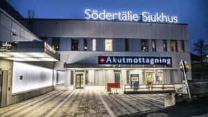 Sodertalje Hospital Entranceat Dusk Wallpaper