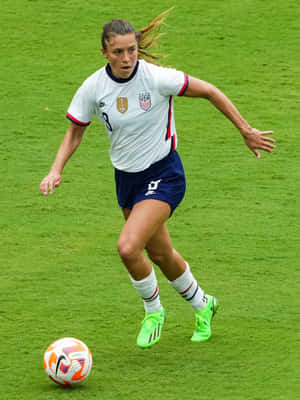 Sofia Huerta Posing On A Soccer Field Wallpaper