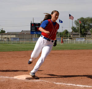 Softball Player Running On The Field Wallpaper