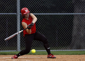 Softball Player Swinging Bat To Ball Wallpaper