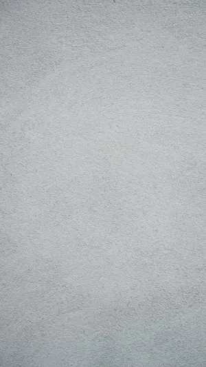 Solid Grey Wall With Subtle Speckles Wallpaper