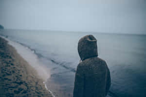 Solitary Person By The Sea Wallpaper