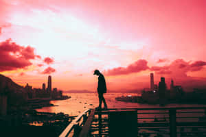 Solitary Person During Sunset Wallpaper