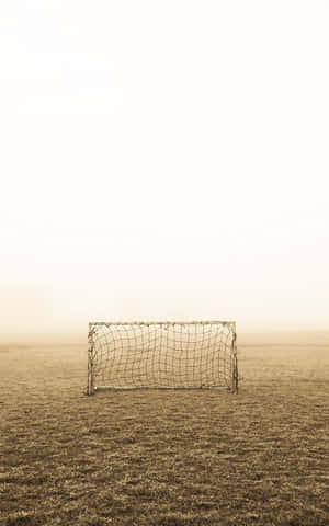 Solitary_ Soccer_ Goal_ In_ Fog Wallpaper
