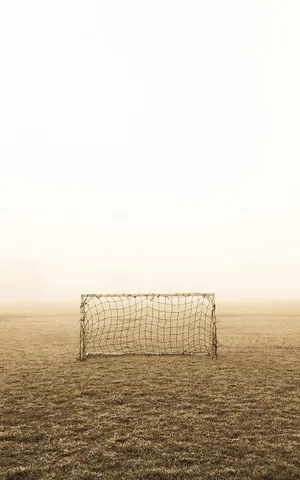 Solitary_ Soccer_ Goal_ In_ Fog Wallpaper