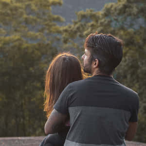 Somatic Man Holding Girl Wallpaper