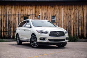 Sophisticated Infiniti Qx60 Gliding Through The City Streets Wallpaper